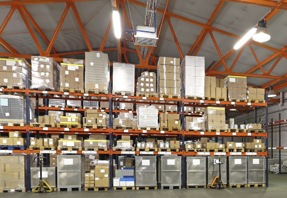 Forklift in front of shelving system at warehouse